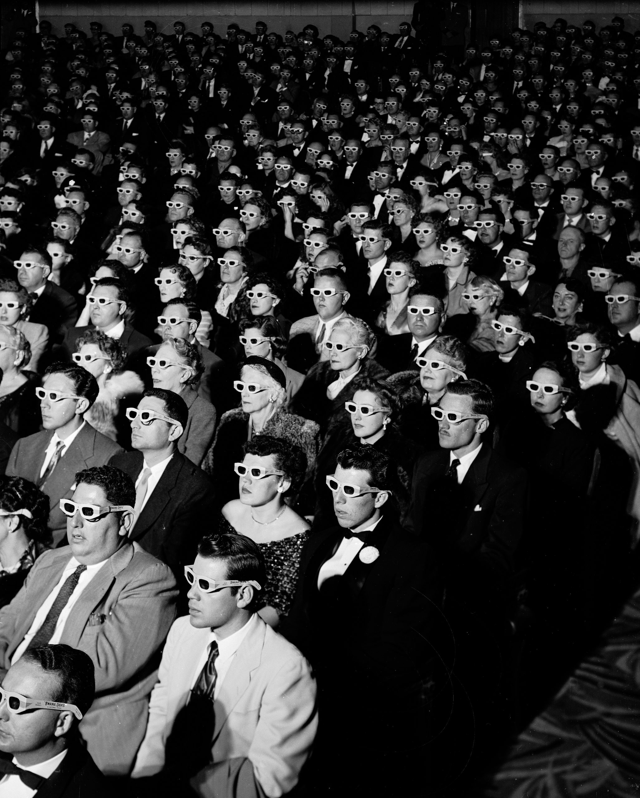 Full frame of movie audience wearing special 3D gl